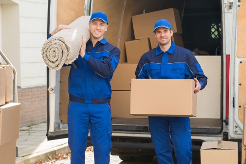 Professional movers handling items in urban setting