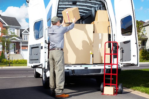 Professional drivers preparing a removal truck for operation